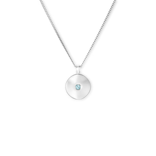 Silver and blue topaz wavy disk pendant
