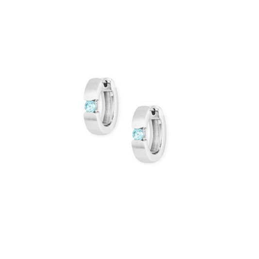 Silver and blue topaz huggies